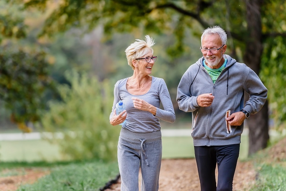 Cheerful,Active,Senior,Couple,Exercising,In,The,Park,Together.,Exercise