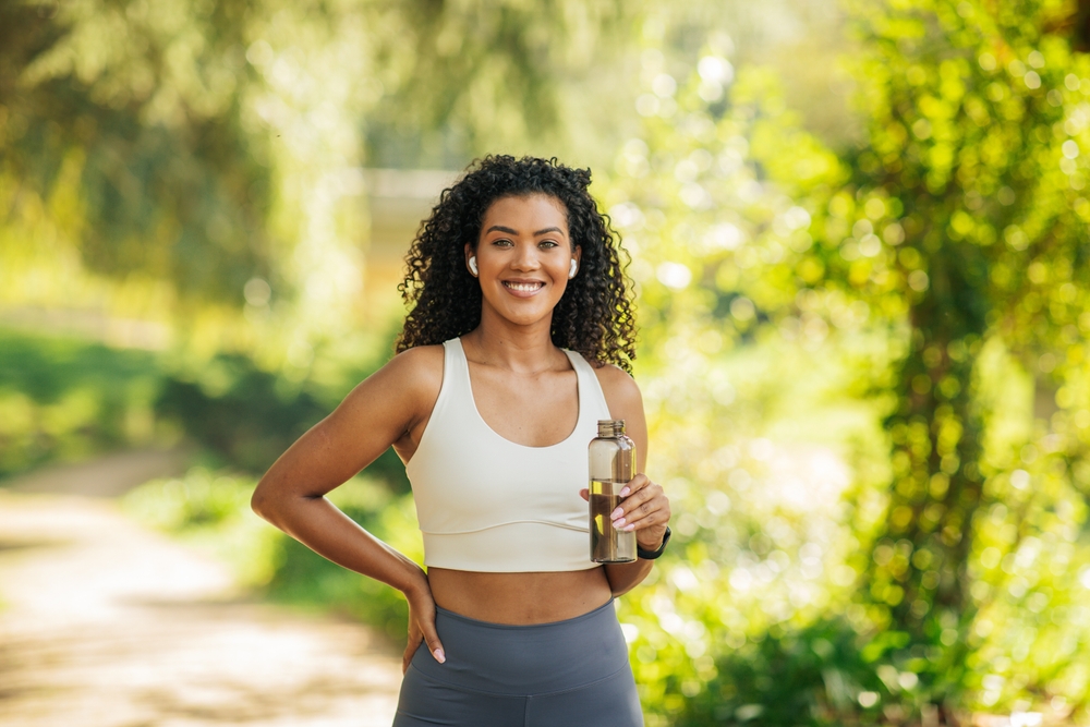 A,Woman,In,A,White,Sports,Bra,Stands,On,A