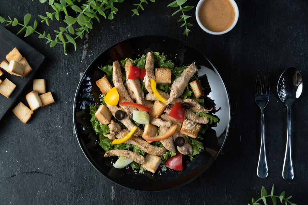 Grilled chicken salad with olives and oranges